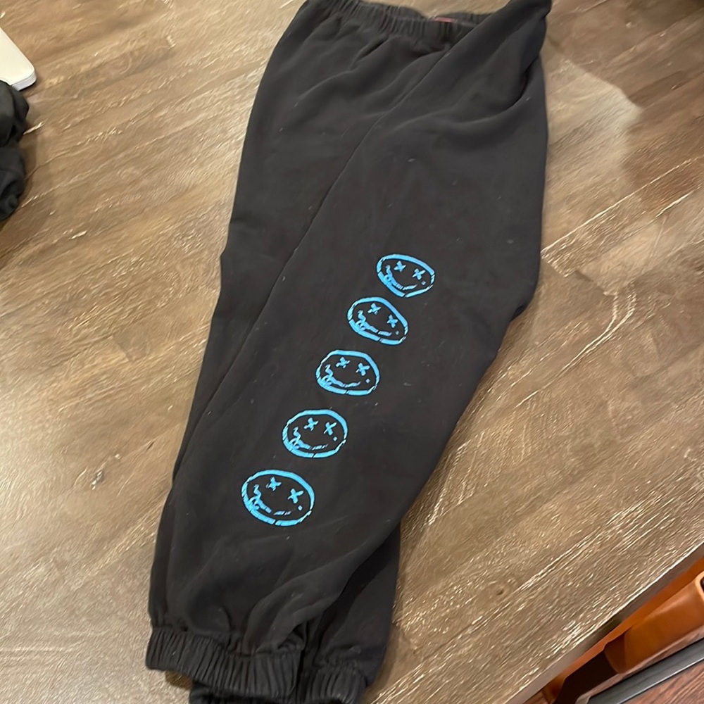 Me.n.u Black Girls Sweatpants with blue smiley face detail on black. Size XL.